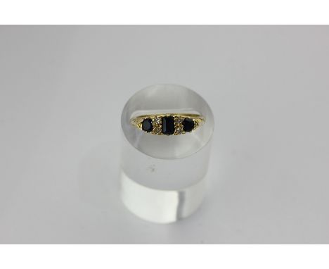 A sapphire and diamond ring in 18ct gold