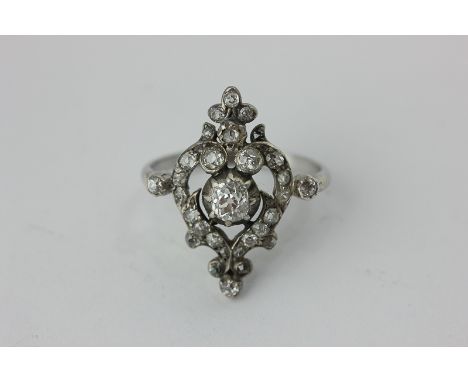 A diamond cluster ring set throughout with mixed old cuts in silver and gold