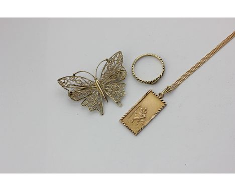 A 9ct gold filigree butterfly brooch, a 9ct gold St Christopher pendant, and a gem set ring, 12.3g gross
