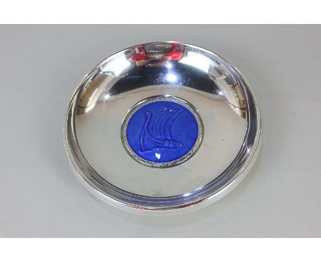 A Norwegian 830 silver dish by Ottar Hval, with central blue enamel design of a ship, the base with stamped mark 15.5cm diame