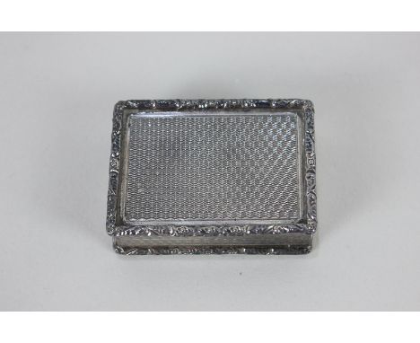 An Elizabeth II silver rectangular snuff box, makers S J Rose &amp; Son, Birmingham 1971, with machined decoration