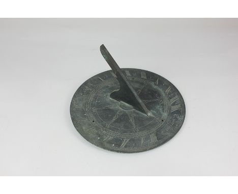 A brass sundial by Dollond London, 25.5cm