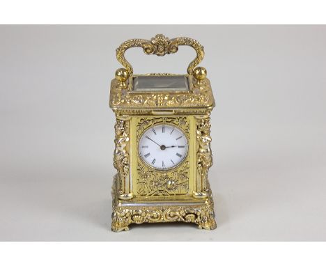 An ornate brass miniature carriage clock by Richard &amp; Cie, probably by Adolf Ollier, the case cast with caryatid corners 