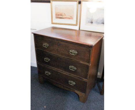 A 19th century mahogany chest of three drawers with brass drop handles and flower embossed back plates, on bracket feet, 74.5