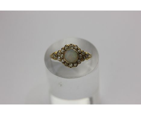 An opal and diamond cluster ring