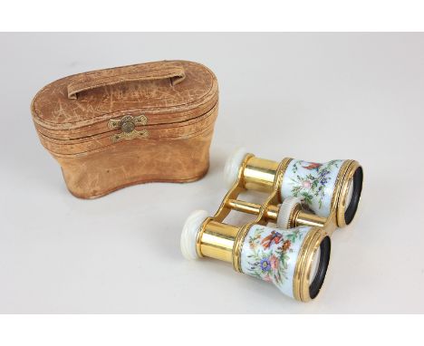 A pair of 19th century opera glasses with mother of pearl eye pieces and focus wheel, on gilt brass telescopic mechanism, dec