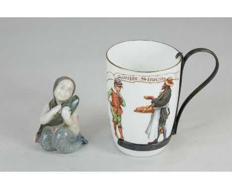 A Royal Copenhagen porcelain model of a mermaid holding a fish, 7cm, together with a Royal Doulton metal mounted porcelain cu