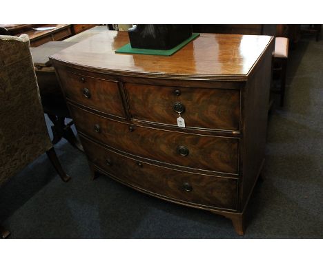 A 19th century mahogany bow front chest of two short over two long drawers with brass drop ring handles and Prince of Wales f