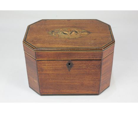 A George III mahogany tea caddy with inlaid floral design, canted corners and two zinc lined compartments, 18.5cm wide