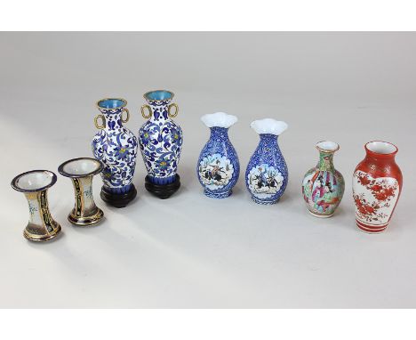 A pair of Middle Eastern miniature painted enamel vases decorated with figures on horseback, 8.5cm, together with a pair of J
