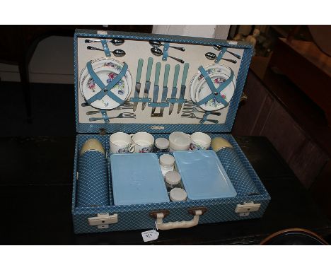 A Brexton picnic hamper retailed by Harrods, with blue chequered design, fitted contents for six, to include two thermos flas