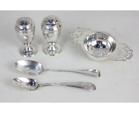 A pair of George V silver peppers, makers Daniel &amp; Charles Houle, London 1917, a silver tea strainer, makers Harrison Bro