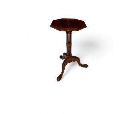 A George IV carved rosewood kettle stand attributed to Gillows
The octagonal moulded top above a beaded edge on triple reeded