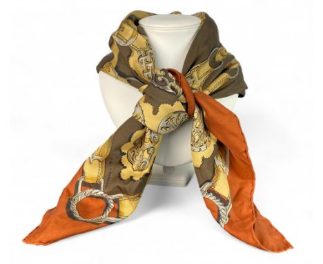 A vintage Herm&egrave;s square silk scarf, 'Cuivreries' designed by Fran&ccedil;oise de La Perriere in 1963
In shades of brow