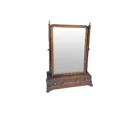 A large George II walnut and parcel gilt toilet mirror
The rectangular bevelled plate within a gilt slip, flanked by moulded 