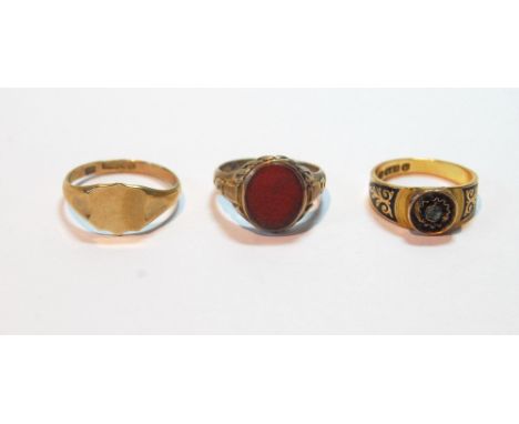 15ct gold mourning ring with small emerald and black enamel, Chester 1885, a carnelian signet ring, and another, plain, both 