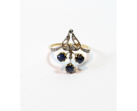 Gold finger ring with a spray of three sapphires and tiny diamonds, size L, in gold fronted with platinum, early 20th century