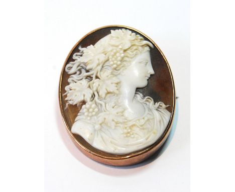 Shell cameo brooch with nicely carved portrait of a woman, in gold, probably 9ct, c. 1900. Condition Report Nice condition.  