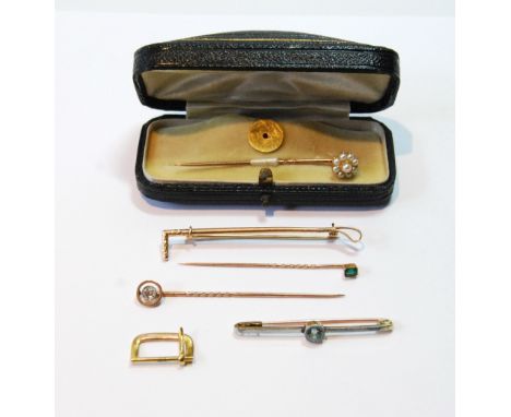 Pearl scarf pin, cased, three others, gem-set, a riding crop pin and a watch strap buckle, '9ct'.