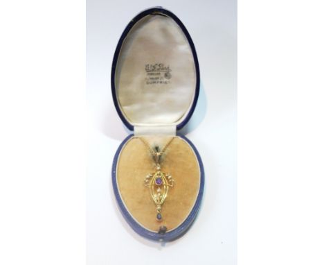 Edwardian amethyst and pearl pendant in gold, '15', on trace necklet, '9c'.