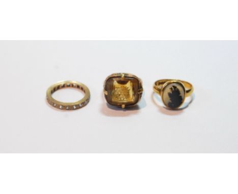 9ct gold signet ring with oval moss agate and a paste eternity ring, '9ct', and another with citrine, adapted from a seal.   
