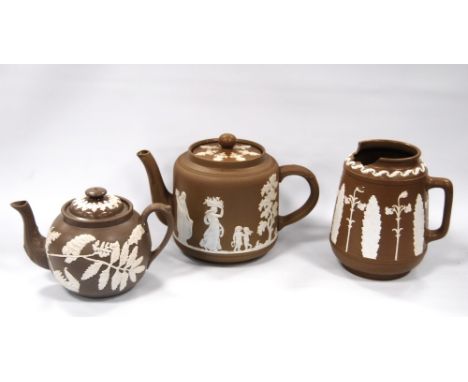 Dudson Pottery brown Jasper ware 'Figures and Trees' pattern teapot, 16cm high, another, globular, 'Fern Wreath' pattern and 