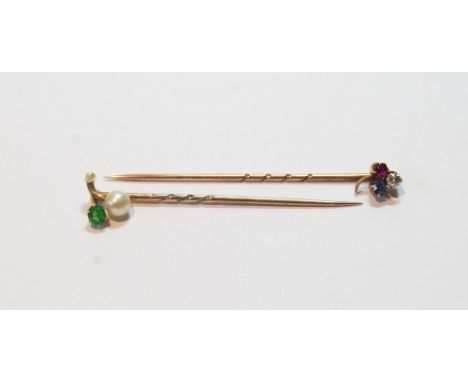 Edwardian gold scarf pin with demantoid garnet and pearl, another, with ruby, diamond and sapphire shamrock.   (2)