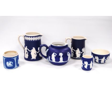Four pieces of Dudson Pottery dark blue Jasper ware in 'Dancing' pattern, the largest 13cm high, and two other similar items.