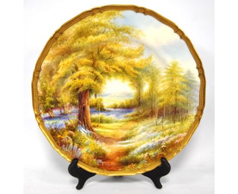 Royal Worcester hand-painted circular plate depicting 'Bluebells, Kew Gardens', by Raymond Rushton, signed, transfer mark, 28
