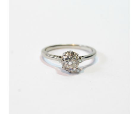 Diamond solitaire ring with old-cut brilliant, approximately .9ct, of almost circular shape, in platinum, size K½.