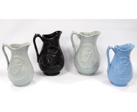 Two graduated Dudson Pottery sage green stoneware 'Night and Morning' pattern moulded jugs, 19cm high and 17cm high, and two 