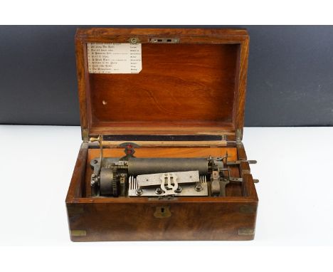 19th Century music box, the mahogany case opening to a 6.25" cylinder , crank-winding. Measures approx 35cm wide 