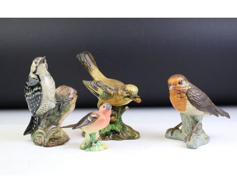 Beswick lesser Spotted Woodpecker, ceramic Jay marked A M Cooper, bisque robin figuirne and small bird figurine. Tallest meas