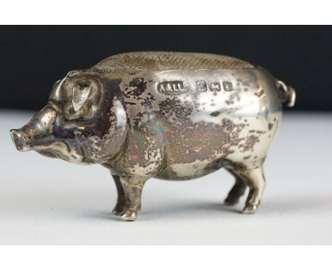 An early 20th century fully hallmarked sterling silver pin cushion in the form of a pig, assay marked for Birmingham and date