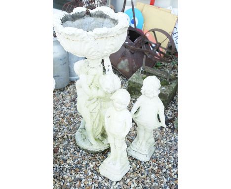 Reconstituted stone garden planter of classical form, together with two reconstituted stone garden statues modelled as a boy 