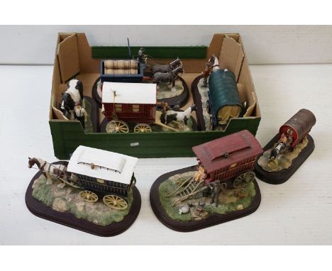 Group of Leonardo collection ceramic figurines to include five gypsy caravans and a barrel cart raised on wooden bases. Blue 
