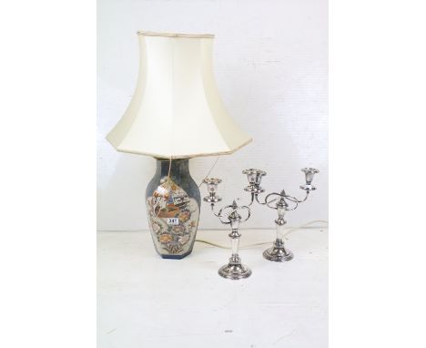 A ceramic oriental style table lamp together with two silver plated candlesticks.