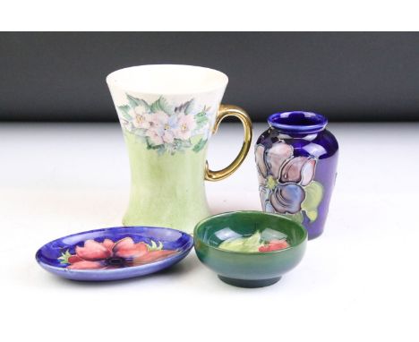 Group of Moorcroft pottery, 4 pieces, to include a hand painted floral mug of waisted form ('M. Crabtree 1952' to base), mini