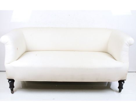 Late 19th / Early 20th century Chesterfield style Sofa covered in plain calico fabric, raised on turned wooden legs with cast