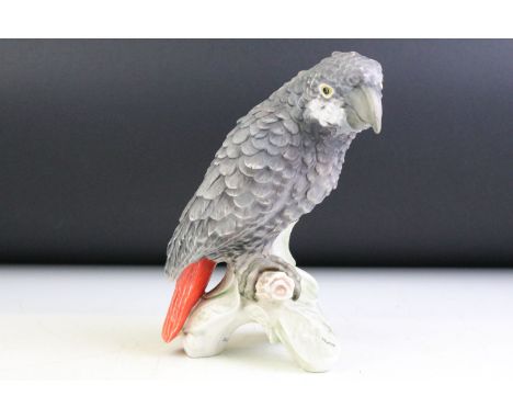 20th Century Goebel porcelain model of an African Grey Parrot perched on a leafy branch, model no. CV79, dated 1967, approx 2