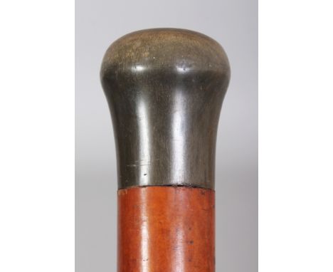 A HORN HANDLED MALACCA WALKING STICK, the horn possibly rhinoceros horn, 32.25in long, the handle 4.5in wide & 4in high.