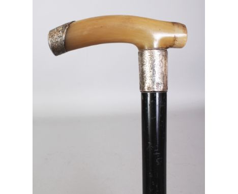 A HORN HANDLED WOOD WALKING STICK, with an engraved and hallmarked silver collar and a similar ferrule, the horn possibly rhi