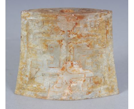 A CHINESE JADE AXE HEAD, of archaic form, each side decorated in shallow relief with a taotie mask, 2.5in wide at widest poin