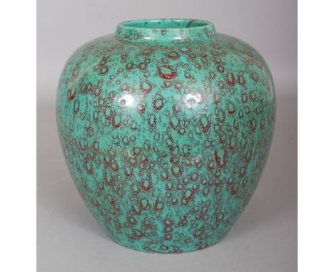 AN UNUSUAL CHINESE PORCELAIN JAR, applied with a green ground red mottled glaze, the base with a moulded Qianlong seal mark, 