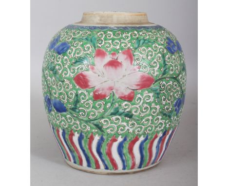 A GOOD 18TH CENTURY CHINESE YONGZHENG PERIOD FAMILLE ROSE GREEN GROUND PORCELAIN LOTUS JAR, painted with scrolling lotus betw