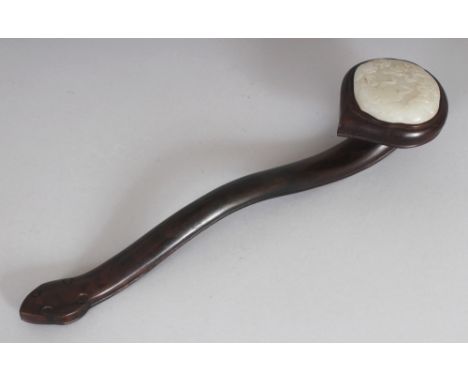 A CHINESE JADE & WOOD SCEPTRE, the ruyi-form head inset with a quatrefoil celadon jade plaque, 14.1in long, the jade itself 2