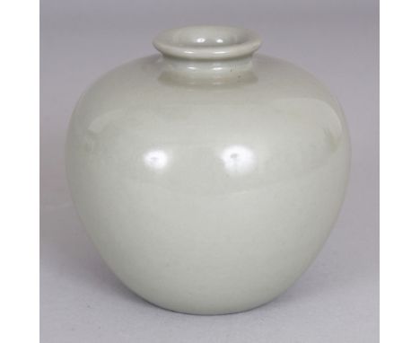 A SMALL CHINESE CELADON GLAZED PORCELAIN JAR, the base with a Qianlong seal mark, 3.5in wide at widest point & 3.25in high.