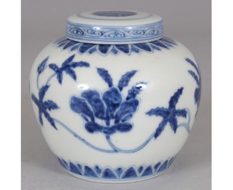 A CHINESE MING STYLE BLUE & WHITE PORCELAIN HEAVEN JAR & COVER, decorated with formal scrolling foliage, the base with a Tian