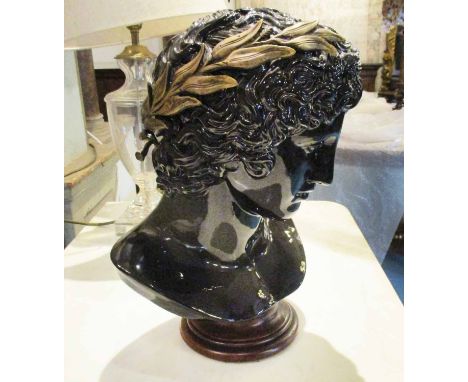 BUST, black ceramic and brass mounted of a Classical youth, 38cm H.