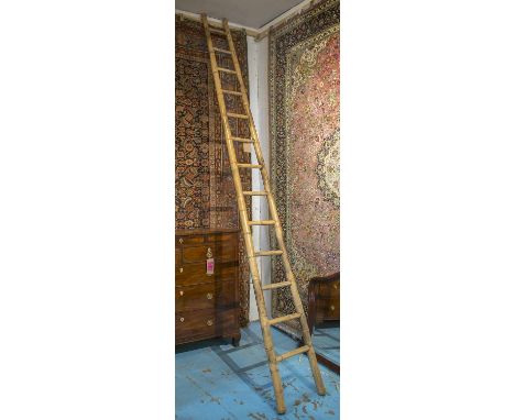LADDER, early 20th century bamboo tapering with twelve treads, 341cm H.